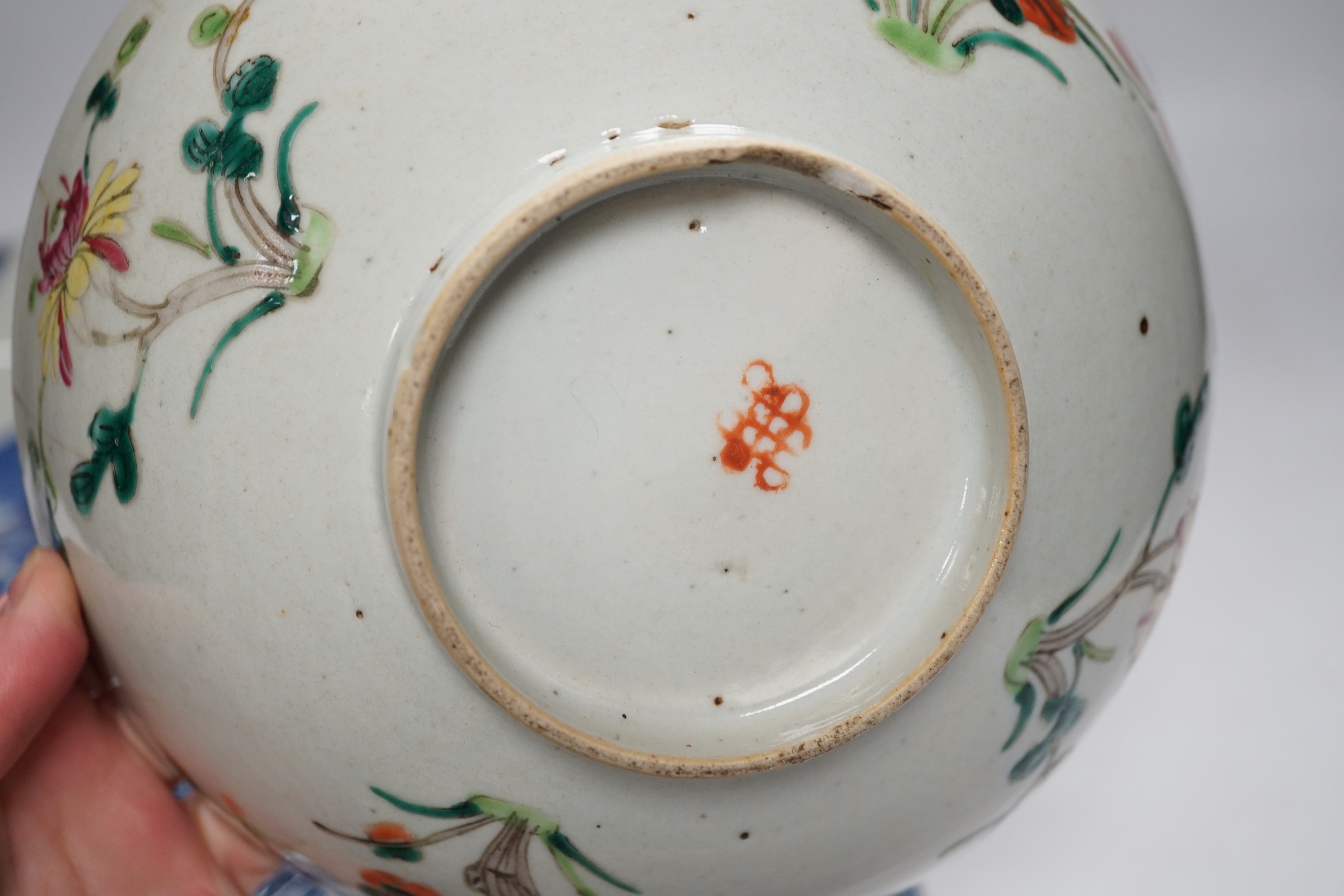 Assorted Chinese and Japanese ceramics comprising a famille rose bowl, two blue and white plates and a blue and white bowl, largest 30cm in diameter